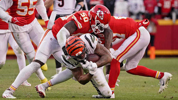 Jan 30, 2022; Kansas City, Missouri, USA; Kansas City Chiefs middle linebacker Willie Gay Jr. (50) tackles Cincinnati Bengals running back Joe Mixon (28) during overtime of the AFC Championship Game at GEHA Field at Arrowhead Stadium. Mandatory Credit: Denny Medley-USA TODAY Sports