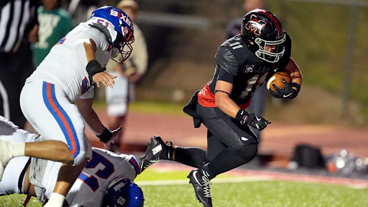 Mustangs run to the end zone for a touchdown during the high school football game between Bixby and Mustang at Mustang High School in Mustang, Okla., Thursday, Oct. 23, 2025. Mustangs run to the end zone for a touchdown during the high school football game between Bixby and Mustang at Mustang High School in Mustang, Okla., Thursday, Oct. 23, 2025.