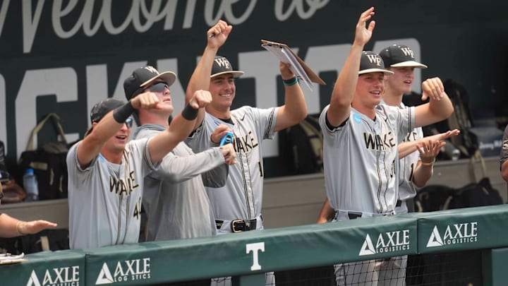 The Wake Forest baseball team celebrates after a base hit during a NCAA regional baseball game between the Cincinnati Bearcats and Wake Forest Demon Deacons at Lindsey Nelson Stadium in Knoxville, Tenn., on June 1, 2025. The Wake Forest baseball team celebrates after a base hit during a NCAA regional baseball game between the Cincinnati Bearcats and Wake Forest Demon Deacons at Lindsey Nelson Stadium in Knoxville, Tenn., on June 1, 2025.