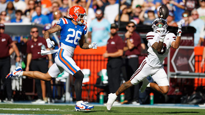 Mississippi State Bulldogs wide receiver Anthony Evans III (3) makes a catch over Florida Gators cornerback Jamroc Grimsley (26) during the first half at Ben Hill Griffin Stadium.