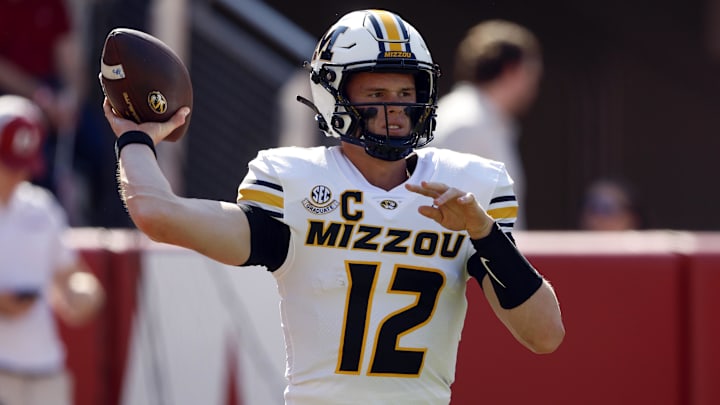 Oct 26, 2024; Tuscaloosa, Alabama, USA;  Missouri Tigers quarterback Brady Cook (12) warms up before a game against the Alabama Crimson Tide at Bryant-Denny Stadium. Mandatory Credit: Butch Dill-Imagn Images