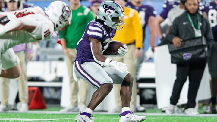 Dec 28, 2023; Orlando, FL, USA; Kansas State running back DJ Giddens runs the ball against NC State.