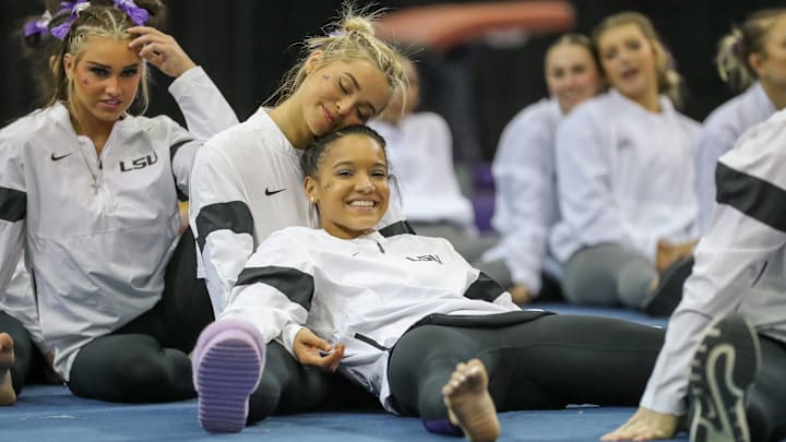 LSU's Olivia Dunne and Haleigh Bryant relax after the Purple & Gold Podium Challenge collegiate woman s gymnastics meet at the Raising Canes River Center in Baton Rouge.
