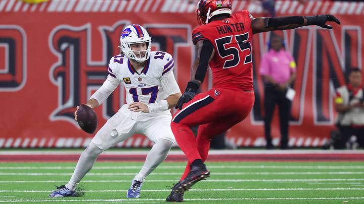 Nov. 20, 2025; Houston, Texas, USA; Buffalo Bills' quarterback Josh Allen (17) runs with the ball as Houston Texans' defensive end Danielle Hunter (55) applies pressure during the second half at NRG Stadium. 