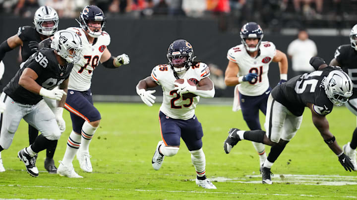 Sep 28, 2025; Paradise, Nevada, USA; Chicago Bears running back Kyle Monangai (25) evades a tackle by Las Vegas Raiders linebacker Devin White (45) during the second half at Allegiant Stadium. Mandatory Credit: Stephen R. Sylvanie-Imagn Images