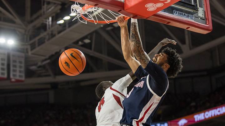 Oct 24, 2026; Fayetteville, AR, USA; Gonzaga Bulldogs forward Izan Almansa (13) dunks the ball in front of Arkansas Razorbacks forward Maper Maker (8) during the second half at Bud Walton Arena. Oct 24, 2026; Fayetteville, AR, USA; Gonzaga Bulldogs forward Izan Almansa (13) dunks the ball in front of Arkansas Razorbacks forward Maper Maker (8) during the second half at Bud Walton Arena.