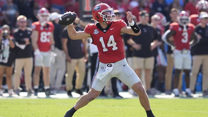 Oct 18, 2025; Athens, Georgia, USA; Georgia Bulldogs quarterback Gunner Stockton (14) passes against the Mississippi Rebels during the first quarter of the game at Sanford Stadium. Mandatory Credit: Dale Zanine-Imagn Images Oct 18, 2025; Athens, Georgia, USA; Georgia Bulldogs quarterback Gunner Stockton (14) passes against the Mississippi Rebels during the first quarter of the game at Sanford Stadium. Mandatory Credit: Dale Zanine-Imagn Images