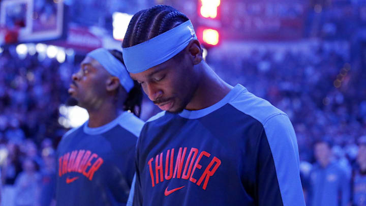 Dec 31, 2024; Oklahoma City, Oklahoma, USA; Oklahoma City Thunder guard Shai Gilgeous-Alexander (2) during the National Anthem before their game against the Minnesota Timberwolves at Paycom Center. Mandatory Credit: Alonzo Adams-Imagn Images