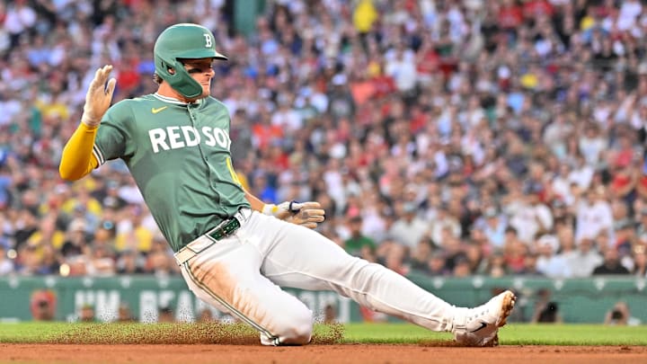 Aug 1, 2025; Boston, Massachusetts, USA; Boston Red Sox left fielder Roman Anthony (19) slides into third base during the third inning against the Houston Astros at Fenway Park. Mandatory Credit: Eric Canha-Imagn Images