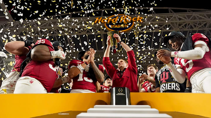 Indiana Hoosiers head coach Curt Cignetti hoists the championship trophy Monday, Jan. 19, 2026, after defeating the Miami (FL) Hurricanes in the College Football Playoff National Championship college football game at Hard Rock Stadium in Miami Gardens.