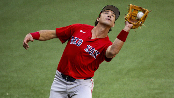 Mar 26, 2024; Arlington, Texas, USA; Boston Red Sox third baseman Bobby Dalbec (29) catches a fly ball hit by Texas Rangers shortstop Josh Smith (not pictured) during the game at Globe Life Field. Mandatory Credit: Jerome Miron-Imagn Images