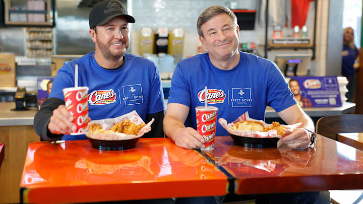 FRANKLIN, TENNESSEE - APRIL 08: (L-R) Luke Bryan and Todd Graves pose as Luke Bryan receives $1M commitment from Raising Cane's owner & founder Todd Graves for The Brett Boyer Foundation in Nashville on April 08, 2025 in Franklin, Tennessee. (Photo by Jason Kempin/Getty Images for Raising Cane's)
