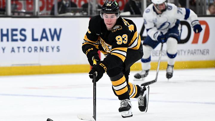 Apr 11, 2026; Boston, Massachusetts, USA; Boston Bruins center Fraser Minten (93) skates with the puck against the Tampa Bay Lightning during the first period at the TD Garden. Mandatory Credit: Brian Fluharty-Imagn Images