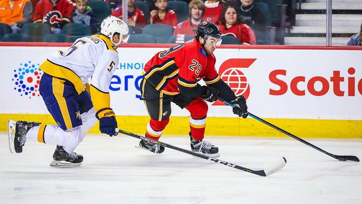 Oct 19, 2018; Calgary, Alberta, CAN; Calgary Flames center Dillon Dube (29) controls the puck against the Nashville Predators during the first period at Scotiabank Saddledome. Mandatory Credit: Sergei Belski-USA TODAY Sports