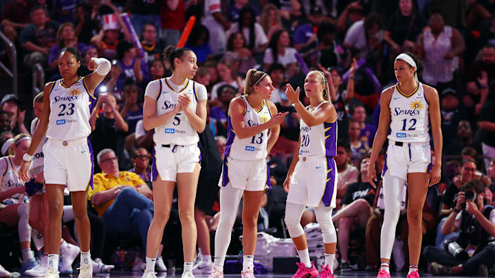 Sep 9, 2025; Phoenix, Arizona, USA; Los Angeles Sparks forward Azura Stevens (23) with forward Dearica Hamby (5), guard Sarah Ashlee Barker (13), guard Julie Allemand (20) and guard Rae Burrell (12) against the Phoenix Mercury during a WNBA game at PHX Arena. Mandatory Credit: Mark J. Rebilas-Imagn Images