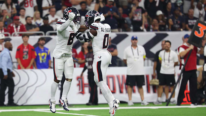 Sep 15, 2025; Houston, Texas, USA; Houston Texans safety C.J. Gardner-Johnson (8) and Houston Texans linebacker Azeez Al-Shaair (0) celebrate after making a tackle during the second quarter against the Tampa Bay Buccaneers at NRG Stadium. Mandatory Credit: Thomas Shea-Imagn Images Sep 15, 2025; Houston, Texas, USA; Houston Texans safety C.J. Gardner-Johnson (8) and Houston Texans linebacker Azeez Al-Shaair (0) celebrate after making a tackle during the second quarter against the Tampa Bay Buccaneers at NRG Stadium. Mandatory Credit: Thomas Shea-Imagn Images