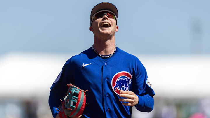 Chicago Cubs outfielder Pete Crow-Armstrong smiles as he walks off the field. 