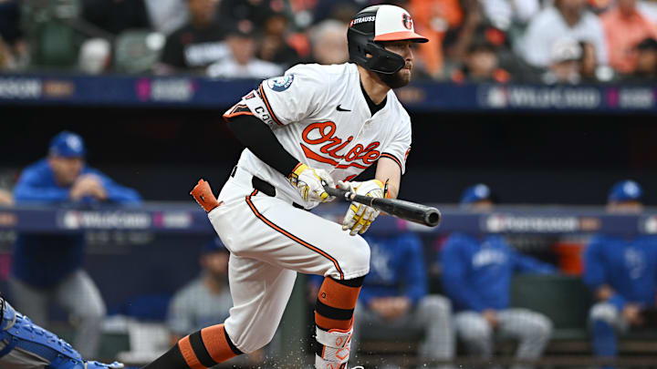 Oct 1, 2024; Baltimore, Maryland, USA; Baltimore Orioles outfielder Colton Cowser (17) hits a single in the second inning against the Kansas City Royals in game one of the Wild Card round for the 2024 MLB Playoffs at Oriole Park at Camden Yards. 