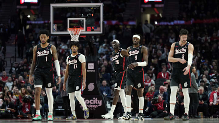 Dec 6, 2024; Portland, Oregon, USA; Portland Trail Blazers (from left to right) Anfernee Simons (1), Shaedon Sharpe (17), Duop Reath (26), Jerami Grant (9), and Deni Avdija (8) walk back to the court after a timeout during the first half against the Utah Jazz at Moda Center. Mandatory Credit: Soobum Im-Imagn Images Dec 6, 2024; Portland, Oregon, USA; Portland Trail Blazers (from left to right) Anfernee Simons (1), Shaedon Sharpe (17), Duop Reath (26), Jerami Grant (9), and Deni Avdija (8) walk back to the court after a timeout during the first half against the Utah Jazz at Moda Center. Mandatory Credit: Soobum Im-Imagn Images