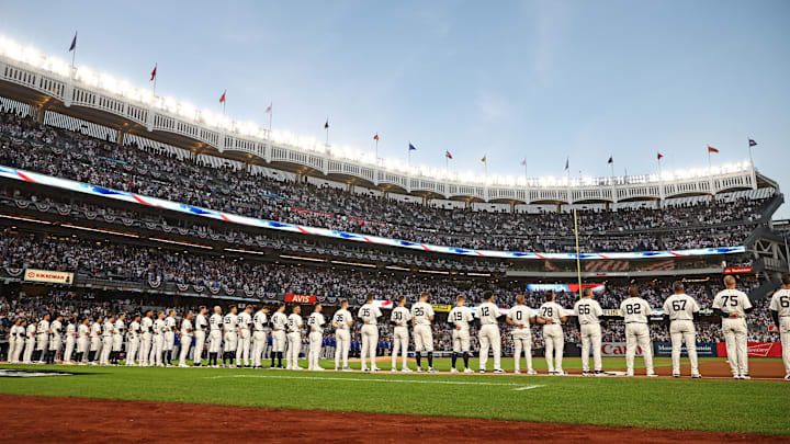 Oct 5, 2024; Bronx, New York, USA; The New York Yankees stand for the National Anthem before the game against Kansas City Royals during game one of the ALDS for the 2024 MLB Playoffs at Yankee Stadium. Mandatory Credit: Vincent Carchietta-Imagn Images