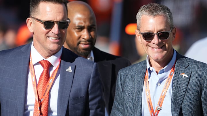 Nov 20, 2022; Denver, Colorado, USA; Denver Broncos CEO Greg Penner (right) and general manager George Paton (left) before the game against the Las Vegas Raiders at Empower Field at Mile High. Mandatory Credit: Ron Chenoy-Imagn Images