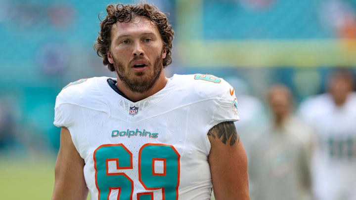 Miami Dolphins guard Cole Strange (69) looks on before a game against the New England Patriots at Hard Rock Stadium.