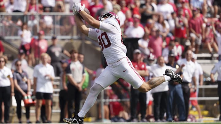 Sep 14, 2024; Madison, Wisconsin, USA;  Alabama Crimson Tide tight end Josh Cuevas (80) catches a pass before scoring a touchdown during the fourth quarter against the Wisconsin Badgers at Camp Randall Stadium. Mandatory Credit: Jeff Hanisch-Imagn Images