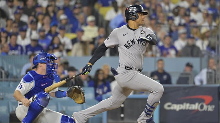 Oct 25, 2024; Los Angeles, California, USA; New York Yankees outfielder Juan Soto (22) hits a single in the sixth inning against the Los Angeles Dodgers during game one of the 2024 MLB World Series at Dodger Stadium. 