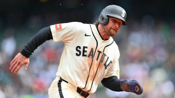 Apr 12, 2026; Seattle, Washington, USA; Seattle Mariners third baseman Brendan Donovan (33) runs towards home plate to score a run against the Houston Astros during the first inning at T-Mobile Park. Mandatory Credit: Steven Bisig-Imagn Images