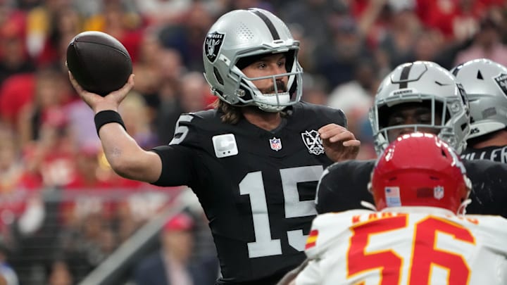Oct 27, 2024; Paradise, Nevada, USA; Las Vegas Raiders quarterback Gardner Minshew (15) throws the ball against Kansas City Chiefs safety Chamarri Conner (27) in the first half at Allegiant Stadium. Mandatory Credit: Kirby Lee-Imagn Images