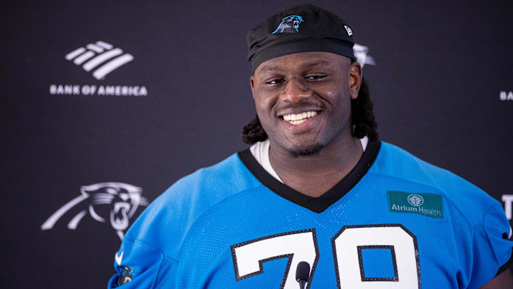 Carolina Panthers offensive tackle Ikem Ekwonu talks with the media after practice during training camp.