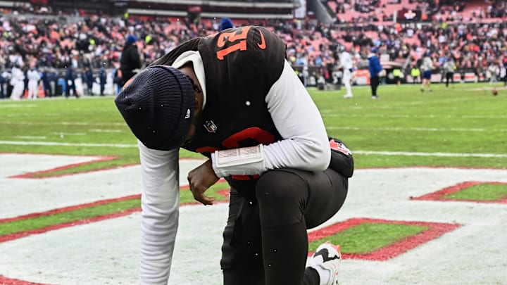 Dec 7, 2025; Cleveland, Ohio, USA; Cleveland Browns quarterback Shedeur Sanders (12) kneels on the field before the game against the Tennessee Titans at Huntington Bank Field. Mandatory Credit: Ken Blaze-Imagn Images