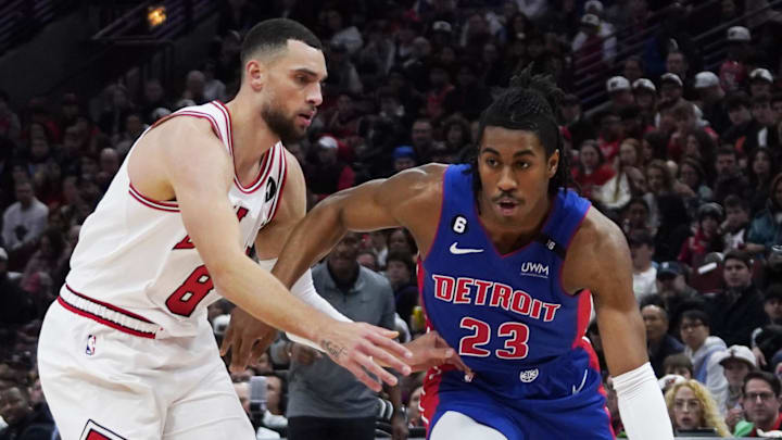 Dec 30, 2022; Chicago, Illinois, USA; Chicago Bulls guard Zach LaVine (8) defends Detroit Pistons Jaden Ivey