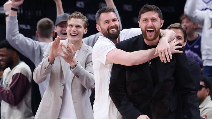 Apr 10, 2026; Salt Lake City, Utah, USA; Utah Jazz forward Lauri Markkanen, forward Kevin Love (middle) and center Jusuf Nurkic react after guard John Konchar completes a triple double against the Memphis Grizzlies during the second half at Delta Center. Mandatory Credit: Rob Gray-Imagn Images