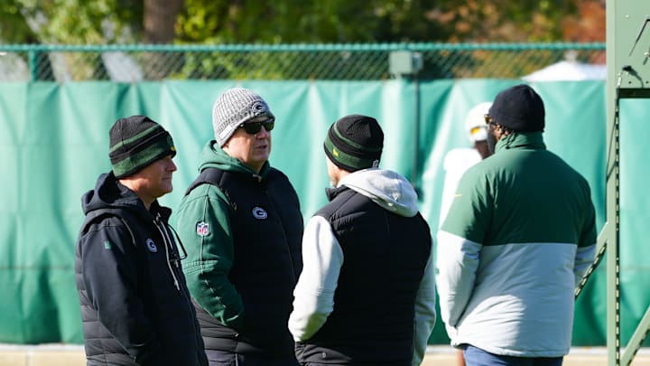 Brian Gutekunst speaks with Matt LaFleur and other coaches during Green Bay Packers practice on