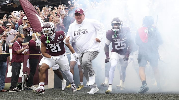 Texas A&M Aggies head coach Mike Elko takes the field prior to the game against the Miami Hurricanes during the first round of the CFP National Playoff at Kyle Field. Mandatory Credit: Maria Lysaker-Imagn Images