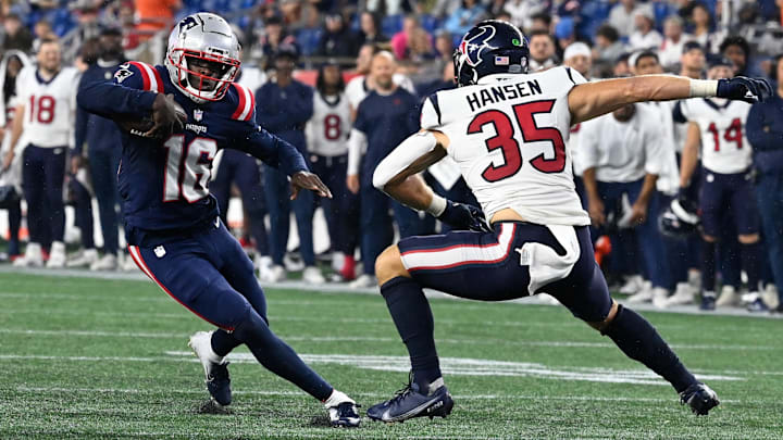 New England Patriots quarterback Malik Cunningham (16) jukes a Texans defender on a nine-yard touchdown run.