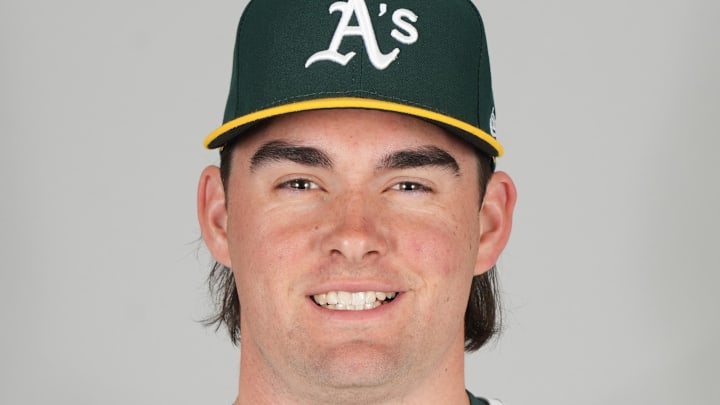 Feb 18, 2025; Mesa, AZ, USA; Athletics pitcher Ryan Cusick (74) poses during photo day. Mandatory Credit: Rick Scuteri-Imagn Images