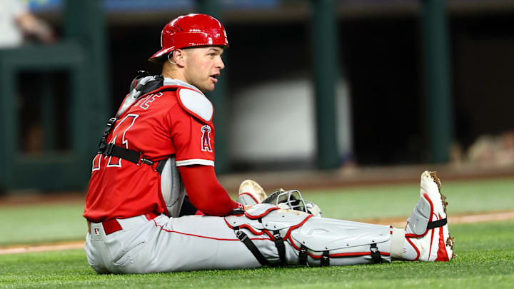 Aug 27, 2025; Arlington, Texas, USA;  Los Angeles Angels catcher Logan O'Hoppe (14) reacts after throwing the ball to first base during the third inning against the Texas Rangers at Globe Life Field. Mandatory Credit: Kevin Jairaj-Imagn Images