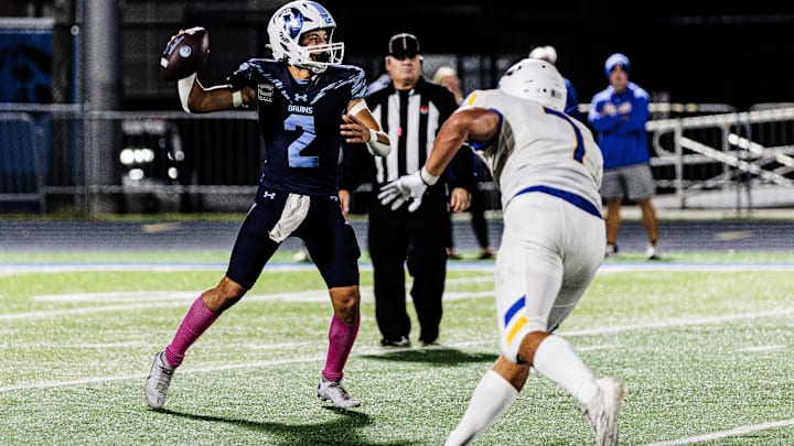Bartlesville's quarterback, Bret Evan, looks for an open team mate while being pressured by Stillwater's Nehemiah Kolone at Thursday's night game at Custard Stadium. Bartlesville's quarterback, Bret Evan, looks for an open team mate while being pressured by Stillwater's Nehemiah Kolone at Thursday's night game at Custard Stadium.