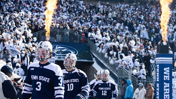 Penn State Nittany Lions hockey players enter Beaver Stadium for a Big Ten game against the Michigan State Spartans.