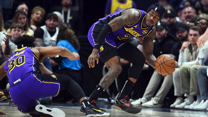 Feb 22, 2025; Denver, Colorado, USA; Los Angeles Lakers forward Jarred Vanderbilt (2) reaches for a loose ball during the first half against the Denver Nuggets at Ball Arena. Mandatory Credit: Christopher Hanewinckel-Imagn Images