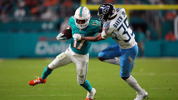 Tennessee Titans cornerback Darrell Baker Jr. (39) attempts to bring down Miami Dolphins wide receiver Jaylen Waddle (17) during the second half at Hard Rock Stadium.