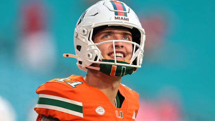 Miami Hurricanes quarterback Carson Beck (11) looks on from the field before the game against the Louisville Cardinals at Hard Rock Stadium. Miami Hurricanes quarterback Carson Beck (11) looks on from the field before the game against the Louisville Cardinals at Hard Rock Stadium.