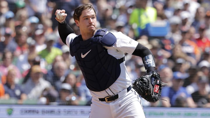 Detroit Tigers catcher Dillon Dingler (13) makes a throw to first for an out.