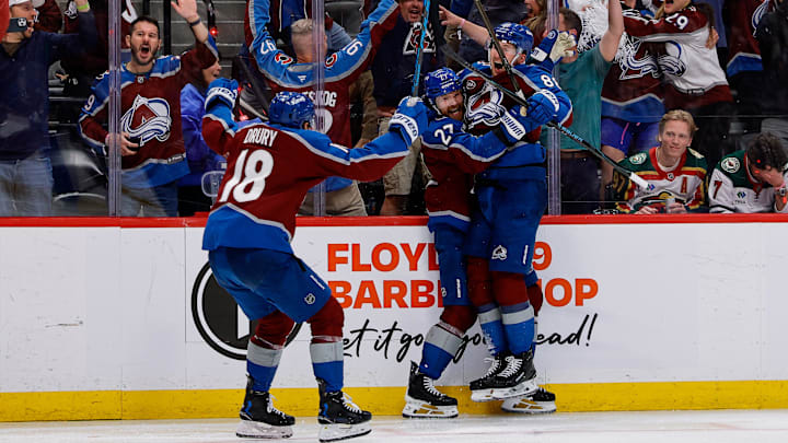 May 13, 2026; Denver, Colorado, USA; Colorado Avalanche defenseman Brett Kulak (27) celebrates his goal with center Martin Necas (88) and center Jack Drury (18) in overtime against the Minnesota Wild in game five of the second round of the 2026 Stanely Cup Playoffs at Ball Arena. Mandatory Credit: Isaiah J. Downing-Imagn Images