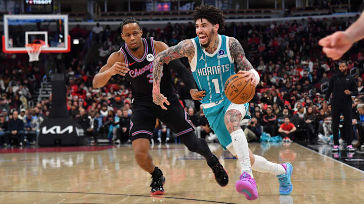 Jan 3, 2026; Chicago, Illinois, USA; Charlotte Hornets guard Lamelo Ball (1) drives the ball against Chicago Bulls forward Isaac Okoro (35) during the first half at United Center. Mandatory Credit: Patrick Gorski-Imagn Images