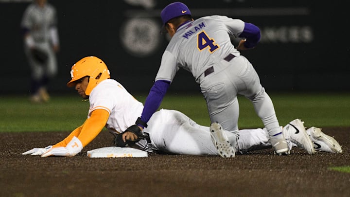 LSU's Steven Milam (4) tags Tennessee's Christian Moore (1) out during a NCAA baseball game at Lindsey Nelson Stadium on Friday, April 12, 2024. Tennessee won 6-3 against LSU.