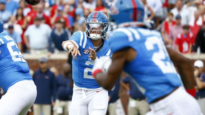 Sep 28, 2024; Oxford, Mississippi, USA; Mississippi Rebels quarterback Jaxson Dart (2) passes the ball to running back Henry Parrish Jr. (21) during the first half against the Kentucky Wildcats at Vaught-Hemingway Stadium. Mandatory Credit: Petre Thomas-Imagn Images