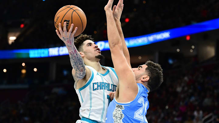 Nov 17, 2024; Cleveland, Ohio, USA; Charlotte Hornets guard LaMelo Ball (1) drives to the basket against Cleveland Cavaliers forward Georges Niang (20) during the first half at Rocket Mortgage FieldHouse. Mandatory Credit: Ken Blaze-Imagn Images Nov 17, 2024; Cleveland, Ohio, USA; Charlotte Hornets guard LaMelo Ball (1) drives to the basket against Cleveland Cavaliers forward Georges Niang (20) during the first half at Rocket Mortgage FieldHouse. Mandatory Credit: Ken Blaze-Imagn Images